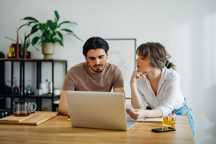 Serious Couple Paying Bills at Home